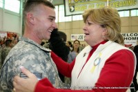 Deb Turbeville stands with her son James