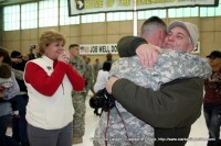 Rusty Turbeville greets his son James as Deb looks on.