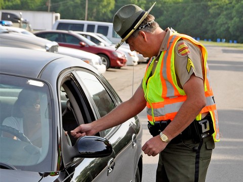 Tennessee Highway Patrolman on a traffic stop. Tennessee Highway Patrolman on a traffic stop.
