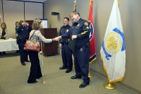 Mayor McMillan congratulates Sgt Brewer as Sgt Minetos looks onward.