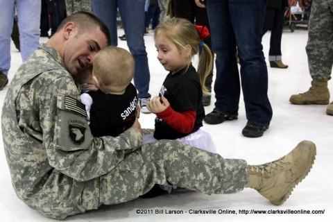 A soldier bowled over by the love of his young children after returning home from Afghanistan