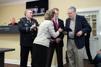 Pat Nowell receiving the certificate from the Mayor. (Photos by Jim Knoll-CPD)