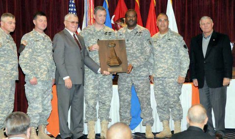 Gen. Richard Cody, retired Master Aviator and event guest speaker, presents Lt. Col. Brian Hughes and Command Sgt. Maj. Johnny Jones from the 160th SOAR with the Lt. Gen. Ellis D. Parker Best Table of Distribution and Allowances Award at the aviation ceremony in Fort Rucker, AL on Feb. 2nd. (Photo by Russell Sellers)