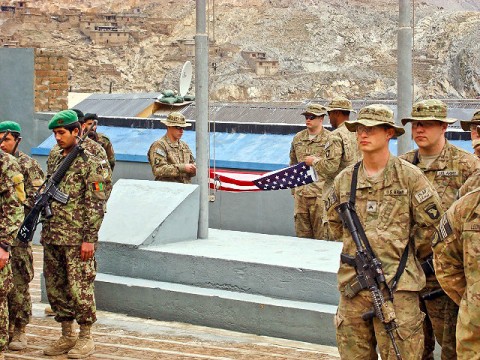 Soldiers from the 1st Battalion, 327th Infantry Regiment, 1st Brigade Combat Team, 101st Airborne Division, take down the final American Flag to fly over FOB Blessing during a transfer of authority ceremony March 4th. U.S. and Afghan soldiers have lived together at FOB Blessing for the three years. (Photo by U.S. Army Capt. Jonathan J. Springer, Task Force Bulldog Public Affairs)