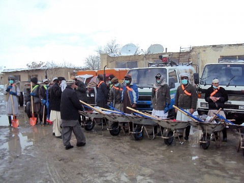 Mohammed Zahir, mayor of Sharana, inspects workers hired as part of a cash-for-work program to clean up the local bazaar March 5th. The program, which officially kicked off Jan. 5th, uses commander’s emergency relief program funds to pay Afghans for cleaning the area around the Sharana bazaar. (Photo by U.S. Army 2nd Lt. Paul Billy, Task Force Currahee)