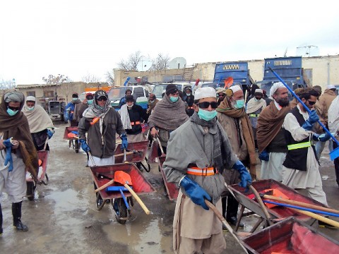 Workers hired in a new cash-for-work program begin their first day cleaning up the Sharana bazaar March 5th. The program, which officially kicked off Jan. 5th, uses commander’s emergency relief program funds to pay Afghans for cleaning the area around the Sharana bazaar in Paktika Province. (Photo by U.S. Army 2nd Lt. Paul Billy, Task Force Currahee)