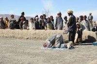 U.S. Army Spc. Stephen Hirt, an imagery analyst with Task Force Currahee, 101st Airborne Division and member of the Islamic faith, prays with Afghans at a village mosque west of Forward Operating Base Sharana, Paktika Province, Afghanistan, March 14th, during a humanitarian aid mission to deliver school and religious supplies donated in part by his mosque in California. (Photo by U.S. Army Sgt. Christina Sinders, Task Force Currahee Public Affairs)