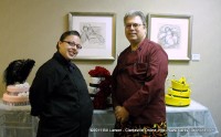 Rosa Guaro, cake designer, discusses future projects with Tom Noerr, manager of The Looking Glass.