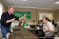 Russ Nowack of Hocus Pocus Entertainment performing one of his tricks for the Better Homes and Garden staff