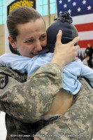 A soldier mom is overwhelmed by emotion as she holds her child again for the first time in a year.