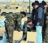 U.S. Army Staff Sgt. Bryan J. Fadely, a team leader from Company A, 4th Brigade Special Troops Battalion, 4th Brigade Combat Team, 101st Airborne Division, and native of Raymondville, Texas, teaches a squad from the Afghan National Army’s new route clearance company how to care for and perform proper functions checks on their M2 .50 caliber machine gun Jan. 27th. (Photo by U.S. Army 1st Lt. Brian Bogenschutz, Task Force Currahee)