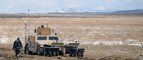 An Afghan National Army route clearance company patrols alongside Company A, 4th Brigade Special Troops Battalion, 4th Brigade Combat Team, 101st Airborne Division, in Paktika Province Feb. 24th. The RCC patrol in humvees with a mine roller attached and a mounted M2 .50 caliber machine gun. (Photo by U.S. Army Spc. Kimberly K. Menzies, Task Force Currahee Public Affairs) An Afghan National Army route clearance company patrols alongside Company A, 4th Brigade Special Troops Battalion, 4th Brigade Combat Team, 101st Airborne Division, in Paktika Province Feb. 24th. The RCC patrol in humvees with a mine roller attached and a mounted M2 .50 caliber machine gun. (Photo by U.S. Army Spc. Kimberly K. Menzies, Task Force Currahee Public Affairs)