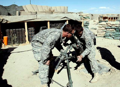 U.S. Army Spc. Nicholas Ketchen, a native from Sarasota, FL, and U.S. Army Spc. Colt Corbin, a native of Beaver Falls, PA, Team, 101st Airborne Division, achieved a first in the U.S. Army history by firing a 120mm Mortar Precision Guided Munition for the first time and hitting within four meters of the target on Forward Operation Base Kushamond March 26th.  (Photo by U.S. Army Spc. Zachary Burke, 55th Combat Camera)