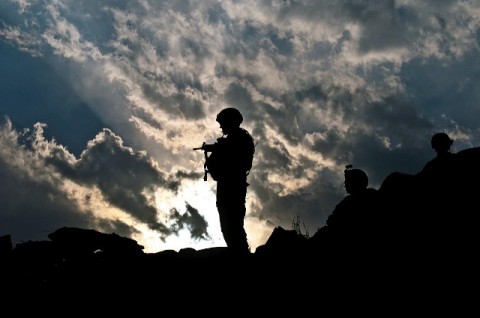 As the sun sets behind U.S. Army Sgt. 1st Class Jamie R. Johnson, 101st Airborne Division, Task Force No Slack, he watches the floors of the Shigal Valley in eastern Afghanistan March 17th. No International Security Assistance Forces were injured during the joint operation where 20 insurgents were killed. (Photo by U.S. Army Sgt. 1st Class Mark Burrell, 210th Mobile Public Affairs Detachment)