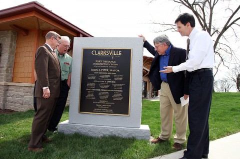 Austin Peay State University professors Richard Gildrie (retired), Phil Kemmerly, Howard Winn (retired) and David Snyder stand next to a monument with their names engraved on it at the city’s new Fort Defiance Interpretive Center. (Photo By Charles Booth/APSU Public Relations and Marketing)