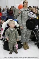 Major Martin sings the Army song as she waits with son and young daughter for the ceremony to be over Major Martin sings the Army song as she waits with son and young daughter for the ceremony to be over