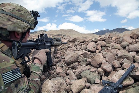 U.S. Army Spc. Sean P. Bedard an infantryman and Counter Insurgency team leader, with Task Force White Currahee, 2nd Battalion, 506th Infantry Regiment, 4th Brigade Combat Team, 101st Airborne Division, pulls security during Operation Overlord, April 14th. Task Force Currahee worked with the Afghan National Police to disrupt the Taliban safe haven and push their forces out of Naka District, Afghanistan during the 11-day mission. (Photo by U.S. Army Spc. Zachary Burke)