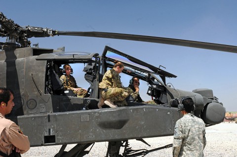 Chief Warrant Officer 2 Elizabeth Kimbrough - an AH-64 Apache pilot - and Capt. Donna Buono (middle) - the commander of Company B, 3rd Battalion, 101st Aviation Regiment, and an AH-64 Apache pilot - introduce Afghan air force Maj. Gen. Abdul Razik Sherzai, the commander of the Kandahar Air Wing, to the helicopter during the general's visit with Task Force Thunder here April 2nd. (Photo by Sgt. 1st Class Stephanie Carl) Chief Warrant Officer 2 Elizabeth Kimbrough - an AH-64 Apache pilot - and Capt. Donna Buono (middle) - the commander of Company B, 3rd Battalion, 101st Aviation Regiment, and an AH-64 Apache pilot - introduce Afghan air force Maj. Gen. Abdul Razik Sherzai, the commander of the Kandahar Air Wing, to the helicopter during the general's visit with Task Force Thunder here April 2nd. (Photo by Sgt. 1st Class Stephanie Carl)
