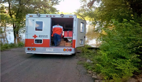 Emergency Service Volunteer Branden Clifton preparing supplies for those who are affected by the flood.