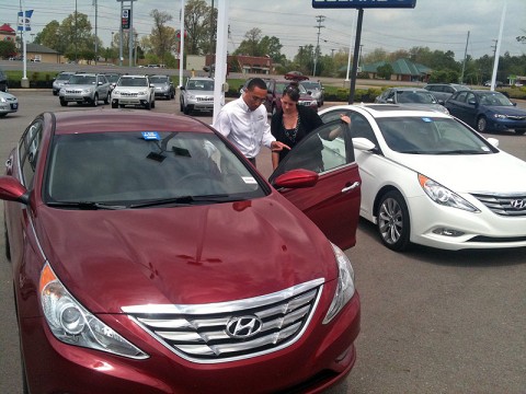 Wyatt Johnson salesperson Chris Crawford showing a customer the new Hyundai Elantra. Wyatt Johnson salesperson Chris Crawford showing a customer the new Hyundai Elantra.
