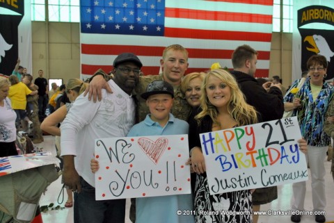 PV2 Justin Comedaux with his family