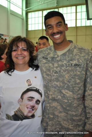 Renee Christian with a photo of her son PFC Zachary Salman and his best friend PFC Joseph Frank