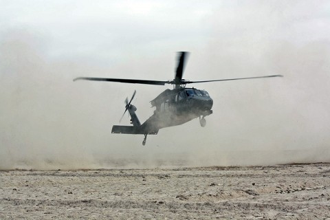 A UH-60M Blackhawk helicopter lands in Deh Gholaman village to drop off supplies. (Photo by Sgt. 1st Class Stephanie Carl)