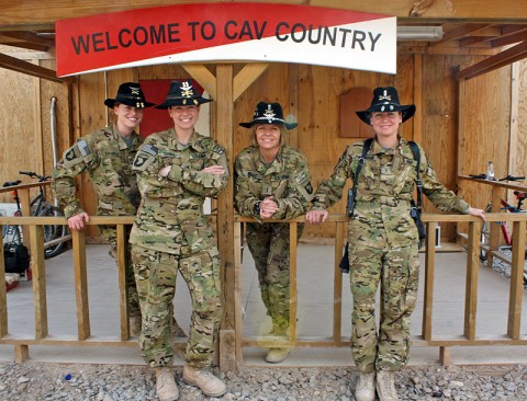 From left to right: Capt. Carmel Cammack, Capt. Donna J. Buono, Chief Warrant Officer 4 Anne Wiley, and Chief Warrant Officer 2 Elizabeth Kimbrough, all leaders within Task Force Palehorse, join for a group shot in outside the task force's operation center at Kandahar Air Field. (Photo by Sgt. 1st Class Stephanie Carl)