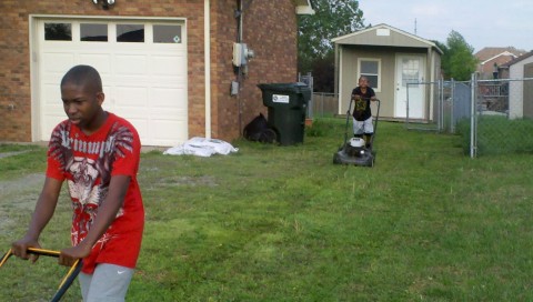 Students in the LEAP Intern Program mowing grass in Clarksville TN.