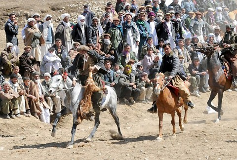 A chapandaz, or Buzkashi player, rides toward the target circle to score during a Buzkashi game in Paryan District, April 7th. More than 1,000 people including local Afghan villagers and Panjshir Provincial Reconstruction Team members attended the event. Buzkashi, which literally translates to “goat dragging”, is the national sport of Afghanistan. (Photo by U.S. Air Force Senior Airman Amber Ashcraft, Panjshir Provincial Reconstruction Team Public Affairs)