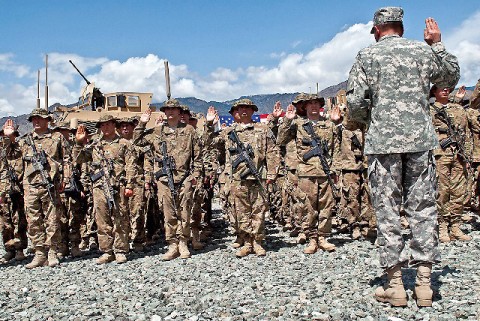 U.S. Army Gen. David H. Petraeus, International Security Assistance Forces commander, recites the oath of re-enlistment to 113 Soldiers assigned to 2nd Battalion, 327th Infantry Regiment, Task Force No Slack, 1st Brigade Combat Team, 101st Airborne Division, at Forward Operating Base Joyce in eastern Afghanistan's Kunar Province April 11th. (Photo by U.S. Army Sgt. 1st Class Mark Burrell, Task Force Bastogne Public Affairs)