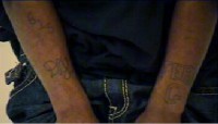 Denzel Jamal Hastings has a tattoo on his right arm that says “615” and “DJ” as well as one on his left arm that reads “JERK” and “G.”