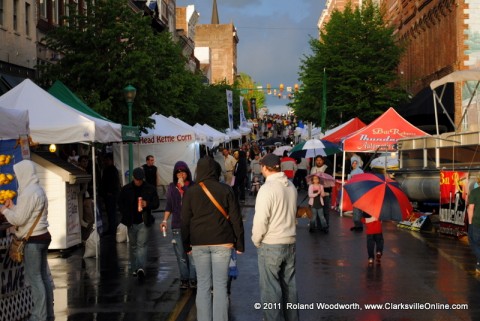 Rivers and Spires Festival attendees take advantage of a break in the rain on Friday