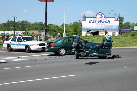 Motorcycle collides with Ford Escort. (Photo by CPD-Jim Knoll)