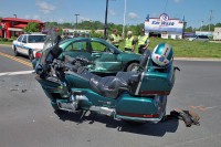 Motorcycle collides with Ford Escort. (Photo by CPD-Jim Knoll)