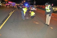 Officers investigating crash (L-R, Officer Melissa Spielhagen, Officer John Reyes, Sgt Vince Lewis) (Photo by Jim Knoll-CPD)