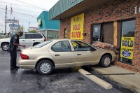 Photo of the vehicle in the Building at 1685 Fort Campbell Blvd. Officer in Photo is Ronnie Brown. (Photo by CPD-Jim Knoll)