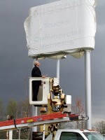 O.B. Garland unveiling the new sign.