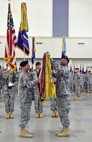 Col. William Gayler and Command Sgt. Maj. Trevor Beharie uncase the 101st Combat Aviation Brigade Colors at Fort Campbell, KY, May 12th, after returning from a year-long deployment in Kandahar, Afghanistan.  (Photo by Sgt. 1st Class Sadie Bleistein)