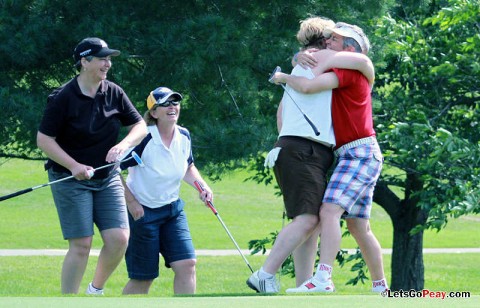 Donna Ruggles, right, hugs teammate Gina Deere, Wednesday morning, after Deere sank a long putt off the fringe of the green on Hole No. 9 during the annual Ladies Golf Tournament. (Austin Peay Sports Information)