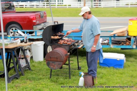 One of the contestants cooking chicken for his entry into the BBQ Cookoff.