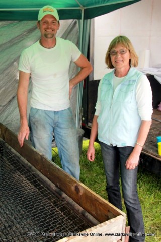 Mike Johnson and Elkie Melton standing next to the BBQ pit used to cook the championship ribs.