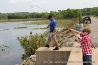 Garrett Snider has just caught a blue gill down at Cross Creeks.