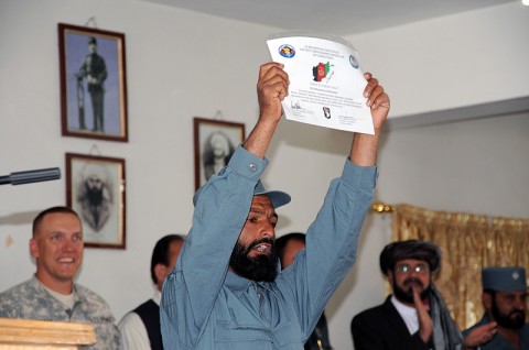 Afghan Uniformed Police officers from Paktika Province salute during the playing of the national anthem of the Government of the Islamic Republic of Afghanistan during the AUP’s advanced training graduation ceremony in Paktika Province, Afghanistan, May 15th. (Photo by U.S. Army Staff Sgt. Matt Graham, Task Force Currahee Public Affairs)