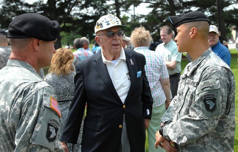 Colonel Viet Luong, Commander of the 3rd Brigade Combat Team, 101st Airborne Division, speaks with a Vietnam-era Veteran of the brigade during a previous reunion of "Rakkasan" Veterans.