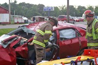 Clarksville Firemen use the jaws of life to extricate Stewart White from his Toyota Corolla. (Photo by Sgt Vince Lewis, CPD)