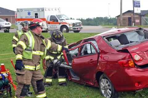 Clarksville Firemen use the jaws of life to extricate Stewart White from his Toyota Corolla. (Photo by Sgt Vince Lewis, CPD)