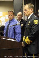 Officer Beau Skinner listens as Chief Al Ansley reads his Commendation for Heroism