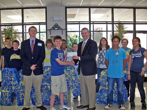 VP Joe Pitts (right) and Credit Analyst Lance Joyner (left) present a check for $500.00 to Northeast Middle School students.