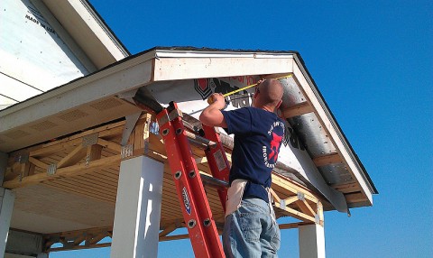 U.S. Army Pvt. Jacob Harbert from Raytown, MO, measures trim along the roofline May 8th. Harbert, a member of 3rd Platoon, B Co., 3rd Battalion, 187th Infantry Regiment, 101st Airborne Division, participated in a Mother's Day Habitat for Humanity home build, helping finish the exteriors of four homes on Ewing Drive in Nashville, TN.  (U.S. Army Courtsey Photo)